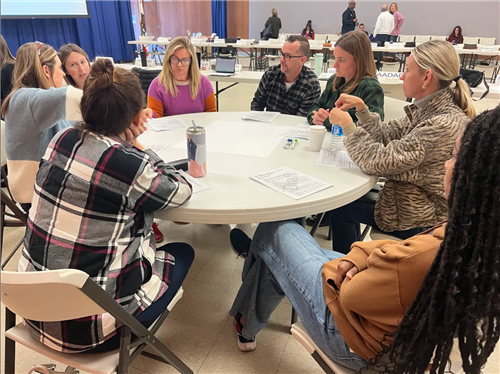 DAC members at a table talking